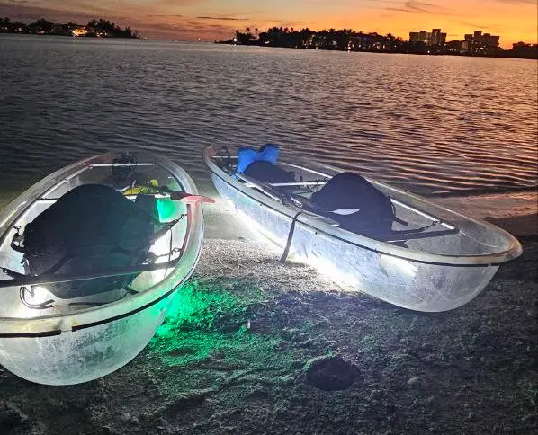 Glowing LED clear kayak at night Sarasota