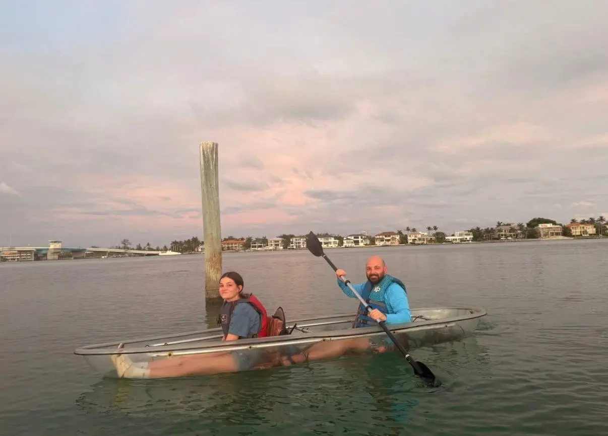 Clear kayak sunset tour on the calm lagoon at Longboat Key Little Beach in Sarasota, Florida